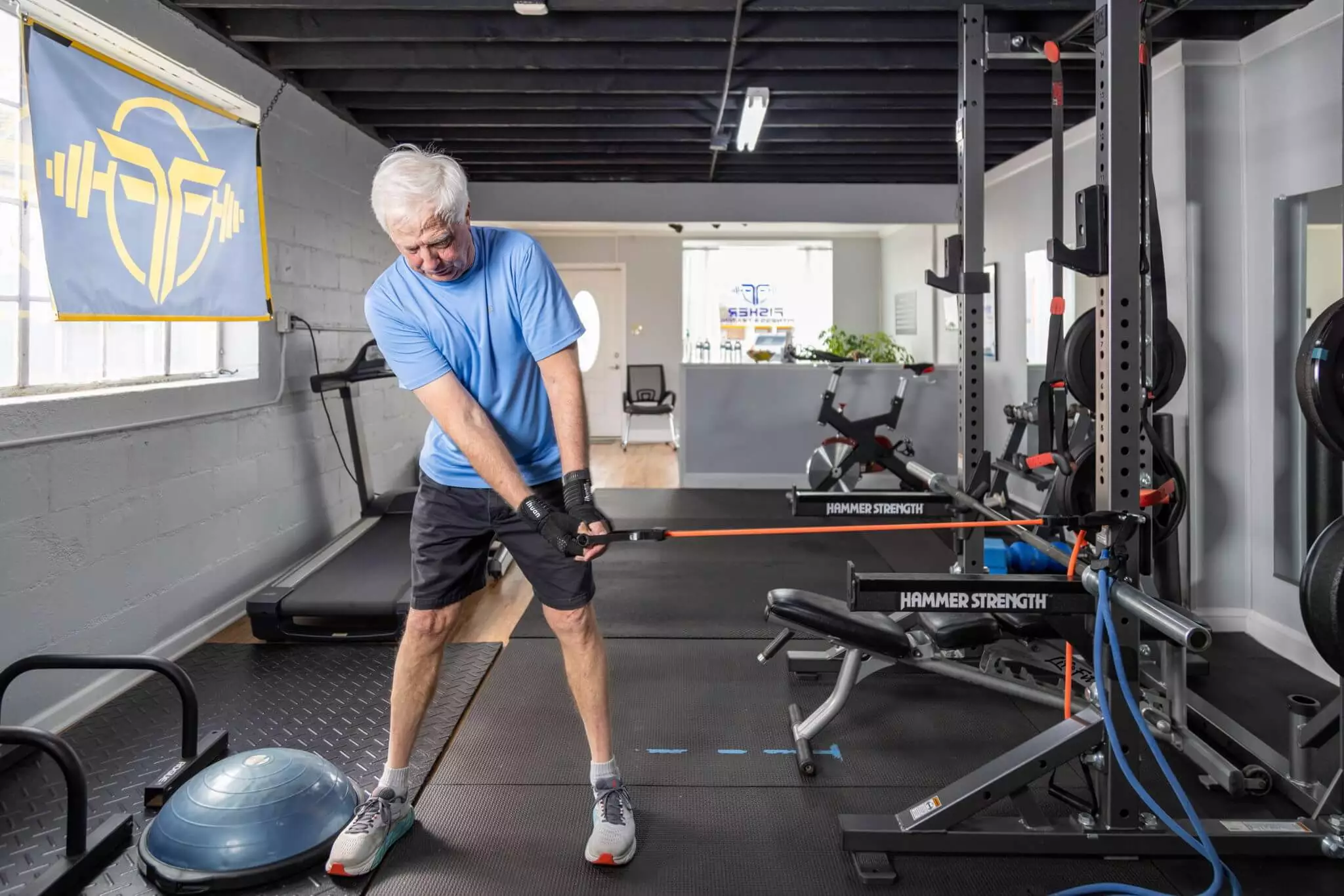 Senior Using Fitness Machine